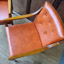 Load image into Gallery viewer, 2 VINTAGE BLACKWOOD AND AMBER VINYL ARMCHAIRS BY BENDIX. PRICE IS EACH.